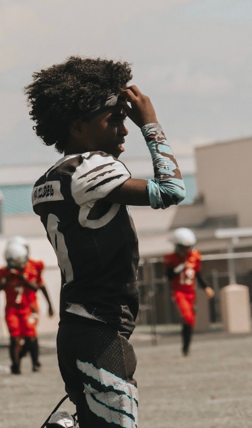 Jace Garcia in black uniform standing on the sideline